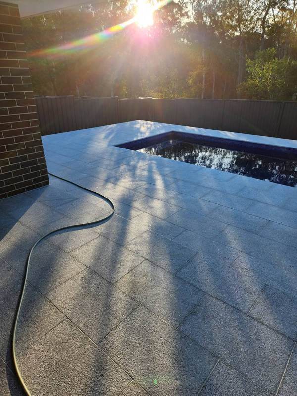Granite pool paving at golden hour